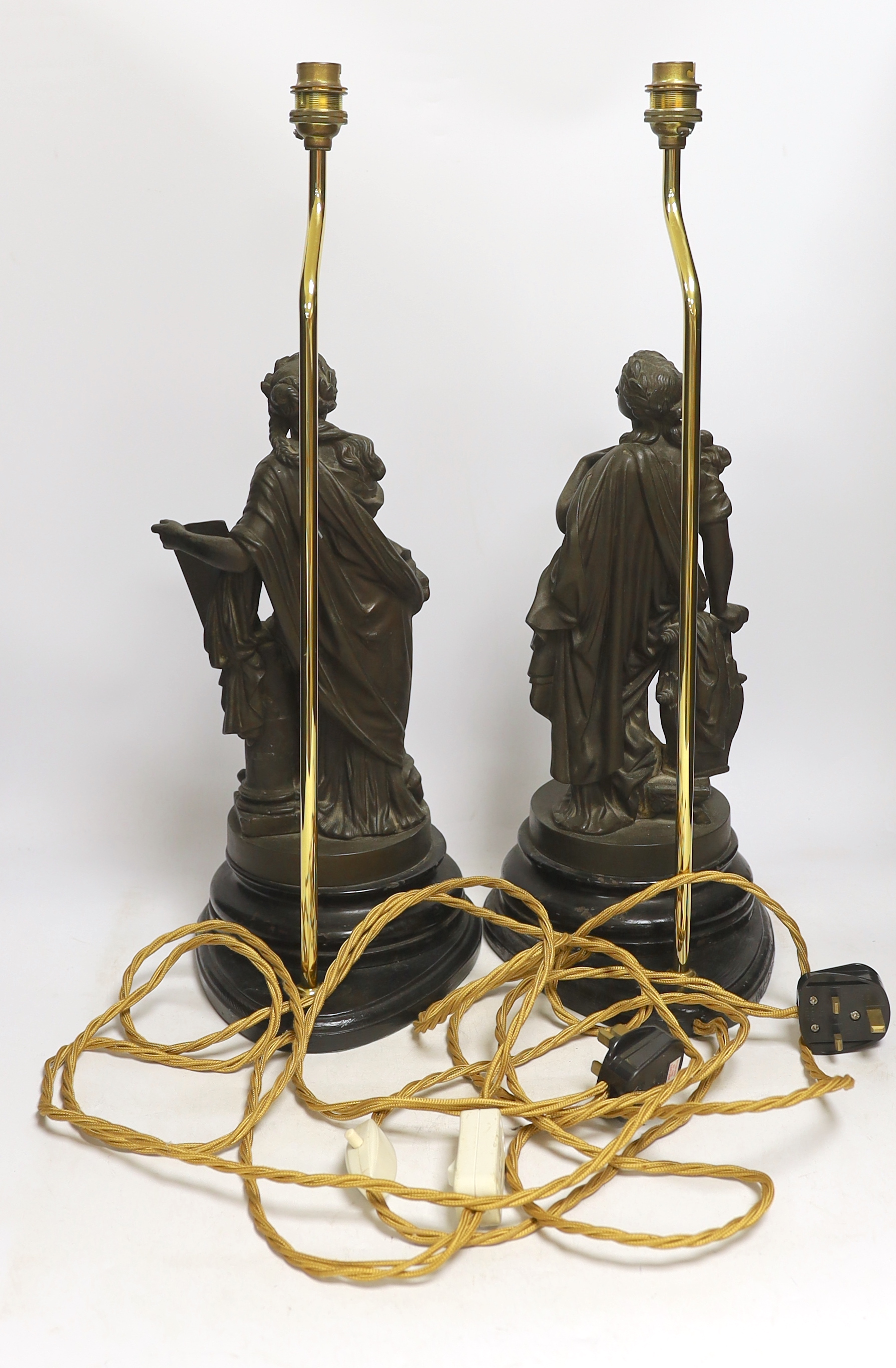 A pair of spelter figural table lamps emblematic of poetry and history, overall 56cm high
